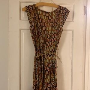 Free People One Sahara printed sleeveless smocked button jumpsuit.  New.